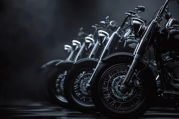 Fototapete A dramatic black background with a lineup of classic motorcycles © Chanagun