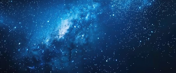 Naklejka premium Vibrant blue galaxy featuring twinkling stars set on a deep black background resembling a night sky