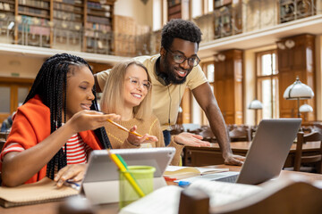 Group of young people working together and looking involved