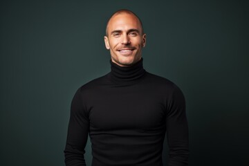 Fototapeta premium Portrait of a happy man in his 40s wearing a classic turtleneck sweater in modern minimalist interior