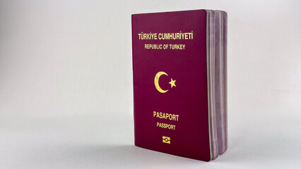 Turkish passport out of EU need visa to travel Europe with red cover before plain white background on the back