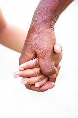 Fototapeta premium Old man holding hand with a child. father son bonding. grandpa and grandson. 