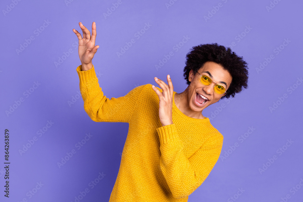 Poster Photo of overjoyed glad nice funny man wear trendy yellow clothes isolated on purple color background