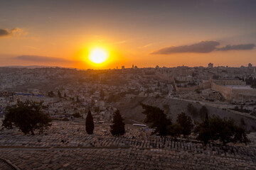 The old Jewish cemetery at the Mount of Olives during the beautiful sunset outside of the Israeli Old Town of Jerusalem.
