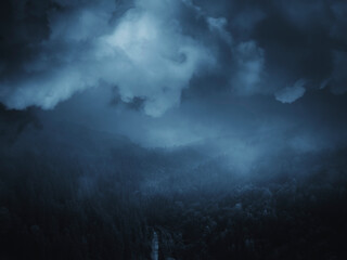 storm clouds over night landscape, dark halloween background