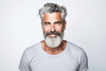 Obraz premium Smiling portrait of a mature beard man on white background