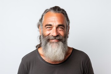 Smiling portrait of a mature beard man on white background
