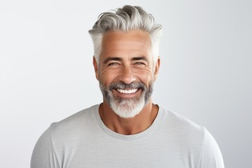 Obraz premium Smiling portrait of a mature beard man on white background