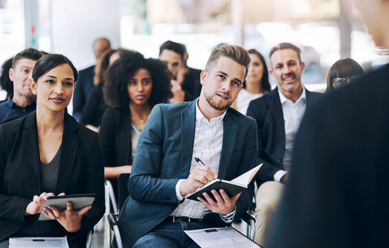 Business, people and taking notes in conference at office for seminar, instruction and learning. Corporate, employees and workshop or convention as audience for information, knowledge or career