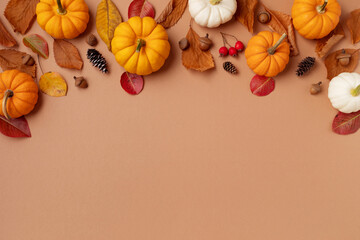 Happy Thanksgiving holiday background from autumn foliage, pumpkins and fall decorations top view.  .