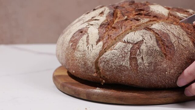 sourdough bread loaf with cracks slicing food rotation