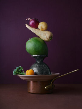 Artistic still life with fresh vegetables and vintage tableware