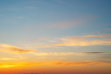 summer evening, sunset in yellow, orange and pink with clouds, background
