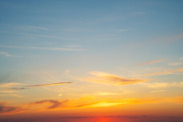 summer evening, sunset in yellow, orange and pink with clouds, background