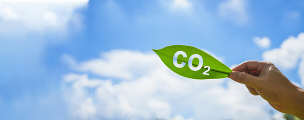 Reduce carbon dioxide emissions to limit climate change and global warming. CO 2 message in a...