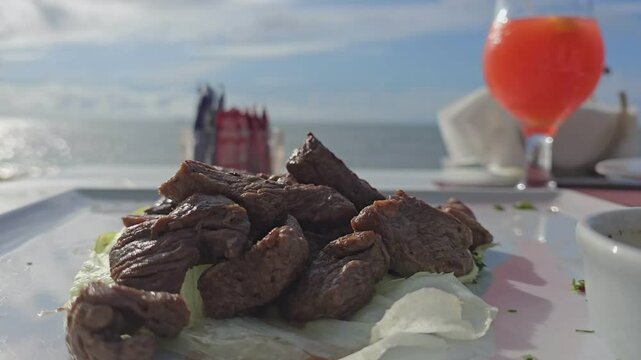 Fresh grilled meat. Grilled beef steak served on the beach