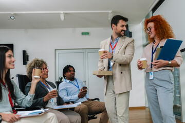 Group of multiracial business people having coffee break from a business meeting.