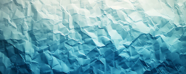 Obraz premium Light blue crumpled paper texture background displaying the intricate folds and creases of the material,