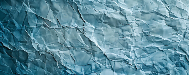Obraz premium Light blue crumpled paper texture background displaying the intricate folds and creases of the material,