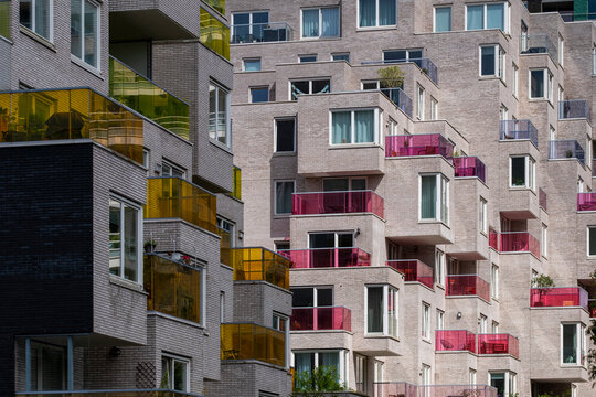 Modern urban apartment complex characterized by its unique architectural design and vibrant, colorful balconies, creating a lively and contemporary living space in Amsterdam Zuid in Netherlands