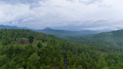 Naklejka premium Aerial view of mountain and forest with clouds in monsoon season of Dang, Gujarat Indian