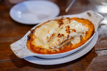 a bowl of hot lasagna