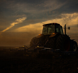 Fototapeta premium Tractor preparing the land for a new crop planting