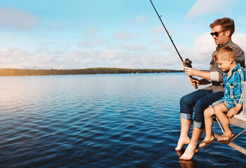Fishing, child and father in nature at lake for vacation, together and relax on dock. Family, fisherman and boy in summer by water for holiday, learning or gear mockup for outdoor adventure with dad