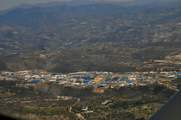 Obraz premium The Aerial view of the industrial area with factories and warehouses seen at Limassol in Cyprus