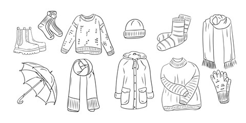 Set of Warm autumn outdoor clothes in outline doodle style. Monochrome hygge contour stickers . Vector clipart of sketchy drawings isolated on white background. Could be used for coloring pages