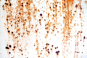 Rust spread on white metals plate texture.Corrosive grunge rusted on old iron.The pattern of grunged rust on wall use as illustration for presentation.Rusty corrosion and oxidized background.