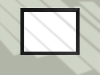 Mock up blank frame hanging on wall in room
