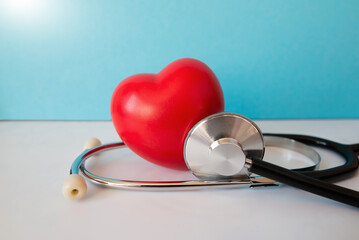 Red heart with medical stethoscope, heart health