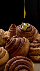 Freshly baked cinnamon rolls with rich cinnamon swirls and icing drizzle