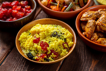 Traditional oriental dishes meat couscous stewed vegetables Muslim Friday meal. Horizontal photo.