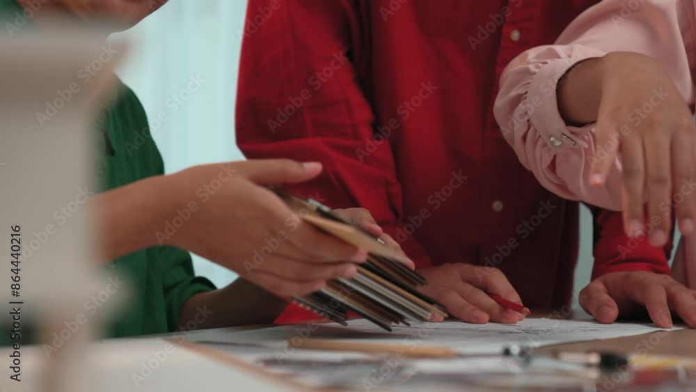 Poster slow motion hand closeup of professional architect and interior designer presenting material and col