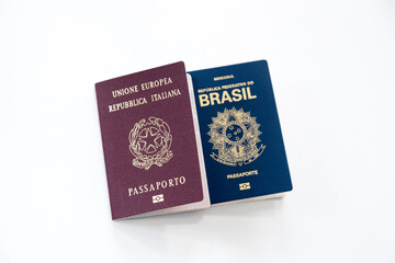 Italian and Brazilian passports on a white background