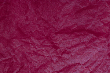 Fototapeta premium Background with crumpled, battered, red pink fabric material with copy space.Empty blank backdrop