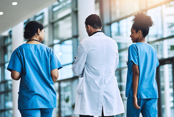 Medical, team and conversation in hospital, walking and support or collaboration for medicine....