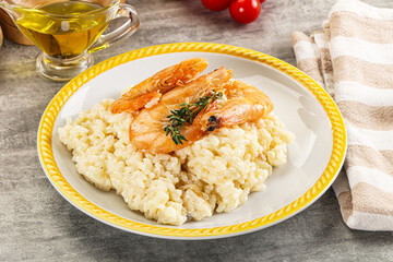 Italian risotto with prawn served thyme
