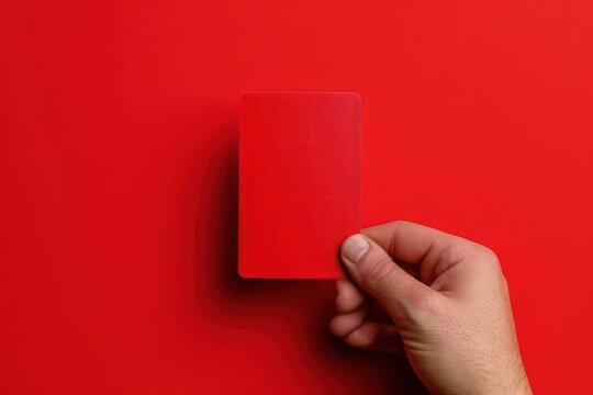 A dramatic red card being issued, isolated with space for copy