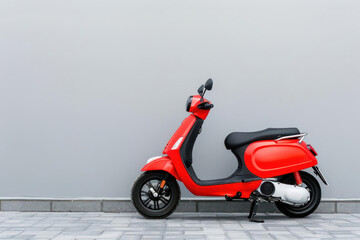 A modern scooter parked on a street, isolated with room for text