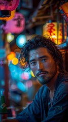 Man standing in front of a bar