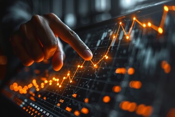 Hand pointing at upward trend on stock market chart