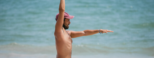Man Stretching on a Beach - Wellness and Fitness Concept