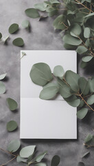 Envelope with greeting card blank mockup and eucalyptus plant on stone table RSVP wedding invitation