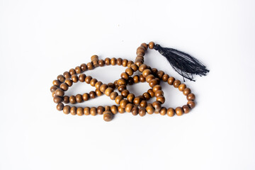 brown prayer beads made from high quality natural wood isolated on white