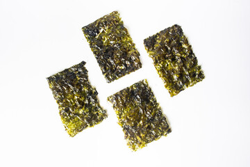 korean roasted crispy nori seaweed snack isolated on white © Zakiavida