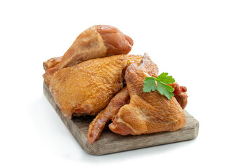 Smoked chicken pieces isolated on white background