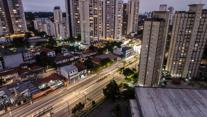 view from above of vehicle traffic and the bus lane of an avenue in the south zone of the city of Sao Paulo in the late afternoon